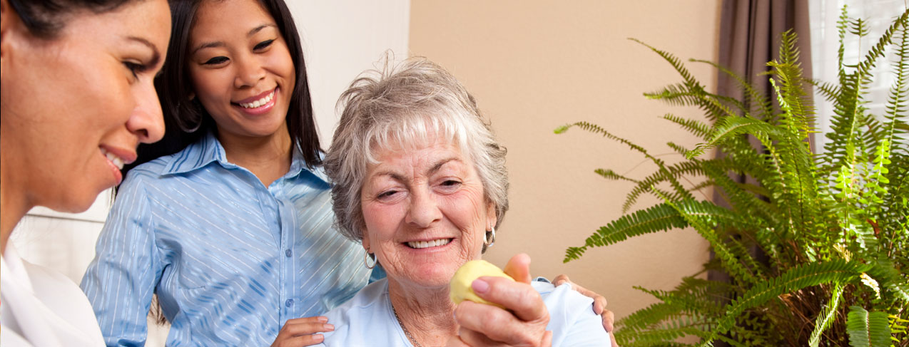 Senior woman receiving home physical therapy