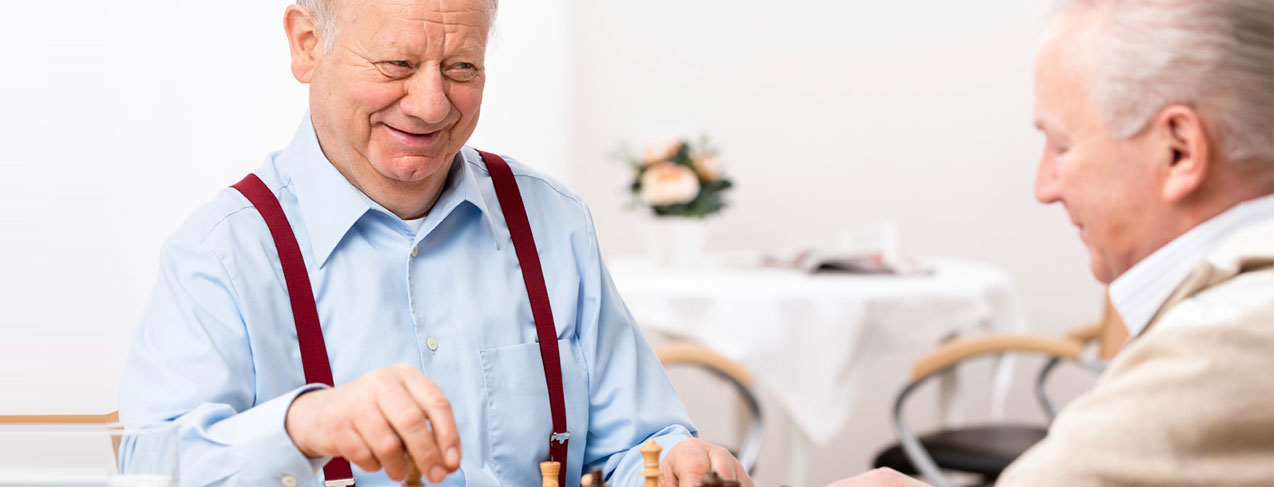 Senior men playing chess